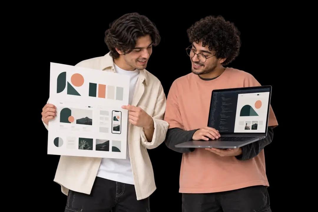 Two people comparing a printed identity board with a website build