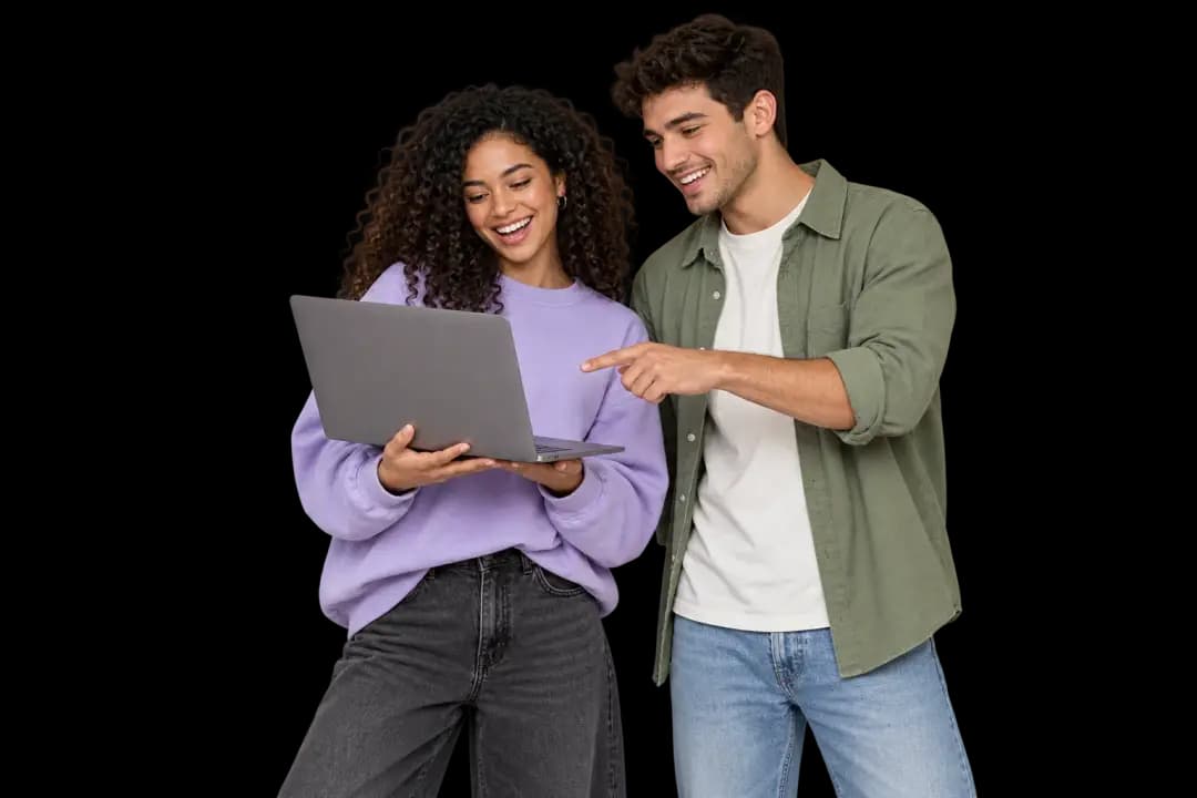 Two people reviewing a website together on a laptop